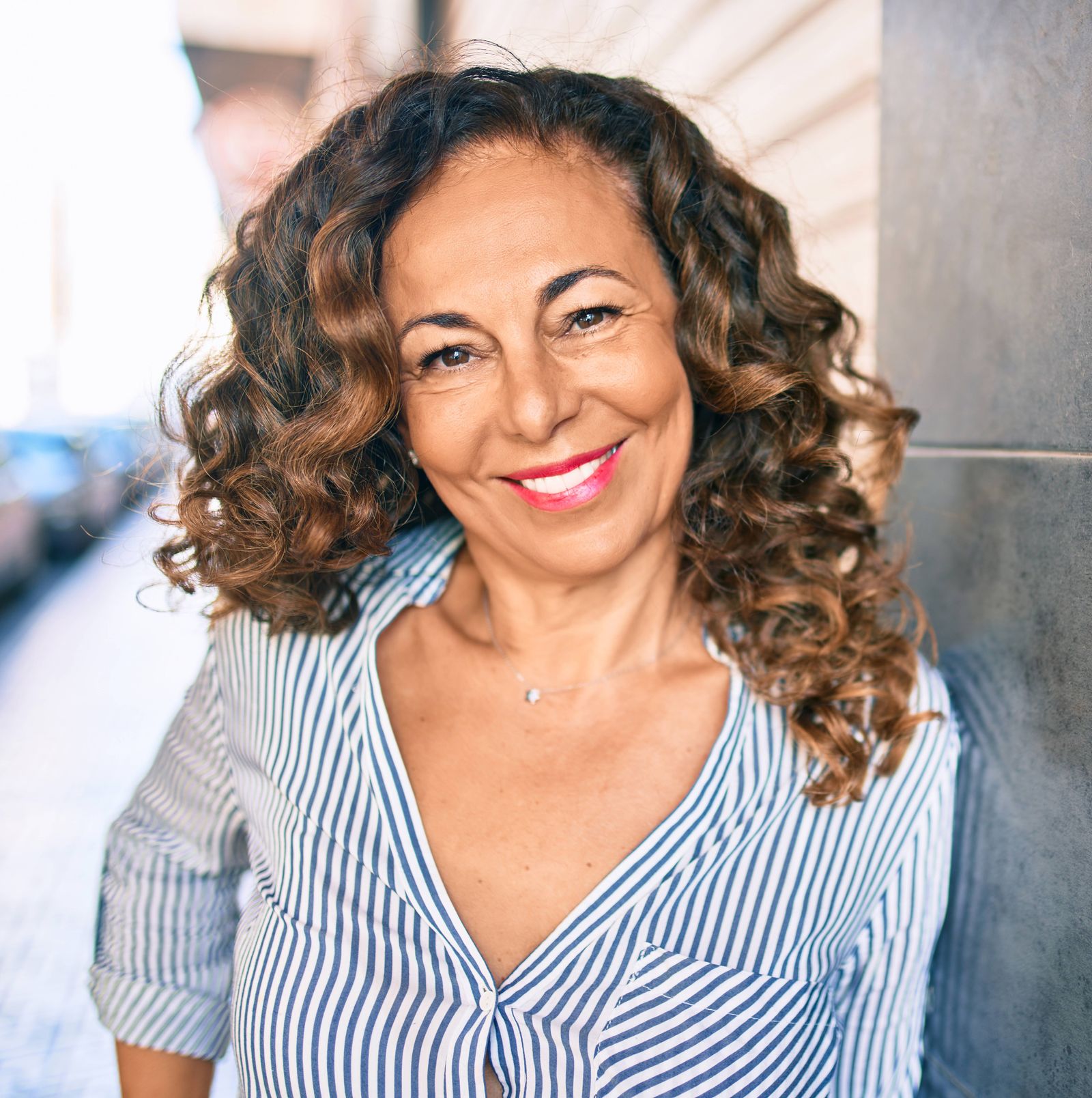 Woman Leaning Against Wall